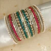 Experience the peak of elegance with the Diana set. This sophisticated stack features a stunning mix of three distinct shades, meticulously balanced with intricate gold spacers and classic pearl borders. Whether you are looking for the perfect Eid bangles or a standout bridesmaid gift, the Diana set offers a versatile, high-fashion look that elevates any formal or festive ensemble.