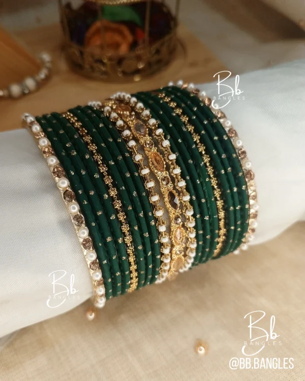 Mehak is a graceful handcrafted ensemble featuring Matt Metal Dot Glitter Bangels and intricate flower copper plated Kara for a classic, feminine aesthetic. Anchored by a thin Pearl and Nug Karay this set is specifically designed for festive afternoon events like Eid or Mehndi where a detailed, heritage-inspired look is desired. Crafted from premium brass and copper alloys, it provides a high-end feel with a lightweight fit for effortless, long-duration wear.