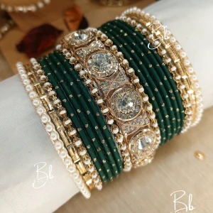 Nilofar is one of the best-selling, must-have handcrafted bangle set available in a wide range of color options, ensuring a perfect match with for any given outfit.It is crafted with multiple color tones to create a high-impact, sophisticated affect. The design is beautifully detailed with a wide Nug Kara, multiple pearl and nug chori, Built with a durable brass alloy base, every piece is meticulously hand-polished to ensure smooth edges and a comfortable, lightweight feel that lasts through long celebrations.
