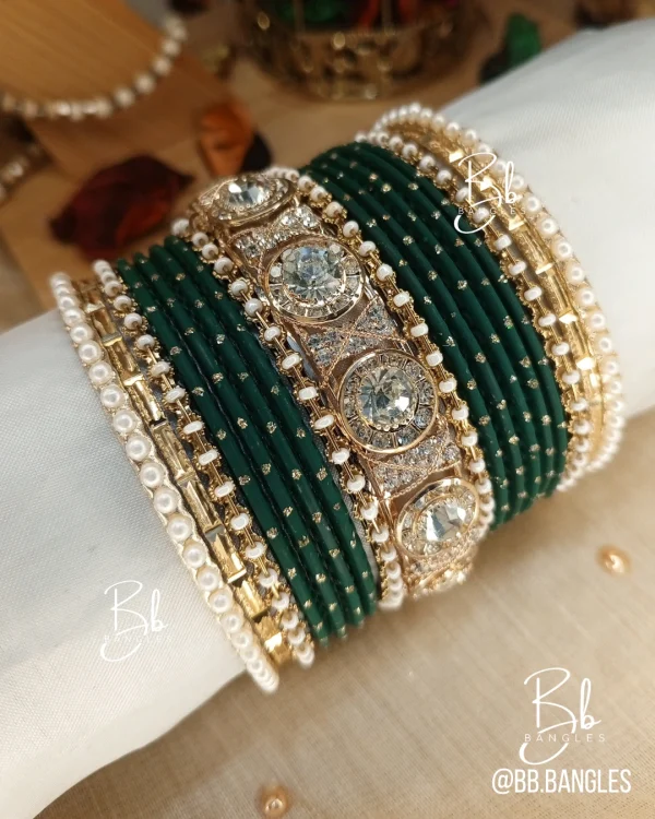 Nilofar is one of the best-selling, must-have handcrafted bangle set available in a wide range of color options, ensuring a perfect match with for any given outfit.It is crafted with multiple color tones to create a high-impact, sophisticated affect. The design is beautifully detailed with a wide Nug Kara, multiple pearl and nug chori, Built with a durable brass alloy base, every piece is meticulously hand-polished to ensure smooth edges and a comfortable, lightweight feel that lasts through long celebrations.