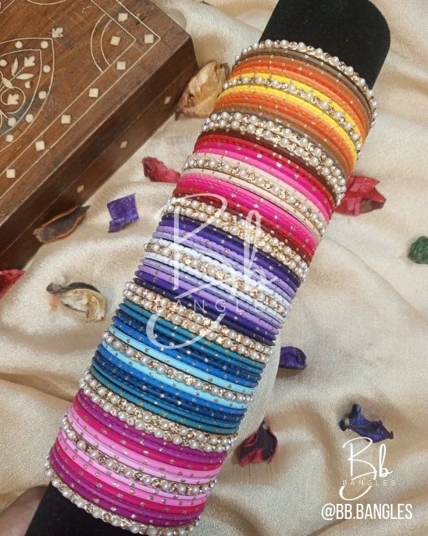 Ombre is our signature multi color mini set.Elevate your style with the ultimate modern-meets-traditional accessory. Our Ombre Collection features a sophisticated gradient transition, moving seamlessly from light to deep tones within five signature color families. Finished with delicate pearls and shimmering crystal accents, this set is designed for the woman who loves a sleek, high-fashion statement. best for eid,party wear, bridesmaid gifts.