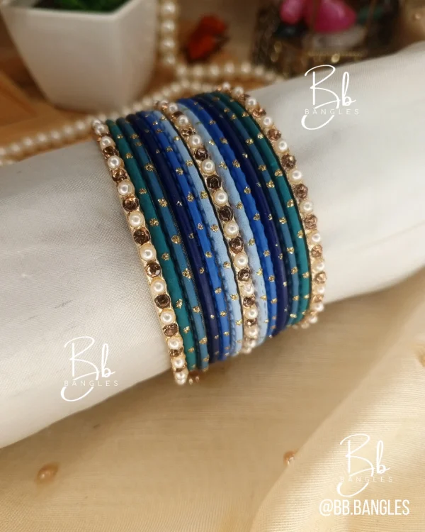 Ombre is our signature multi color mini set.Elevate your style with the ultimate modern-meets-traditional accessory. Our Ombre Collection features a sophisticated gradient transition, moving seamlessly from light to deep tones within five signature color families. Finished with delicate pearls and shimmering crystal accents, this set is designed for the woman who loves a sleek, high-fashion statement. best for eid,party wear, bridesmaid gifts.