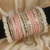 Noor – Shades of Peach A bridal statement set featuring a Reverse American Diamond Jhumki Kara, Premium Shahi Gajray with golden accents, and matching Indian Sikka Work Karay. Enhanced with thin karay in pearls, crystals, and wire work, paired with matte and glossy bangles in elegant peach tones. Perfect for weddings, valima, and special celebrations.