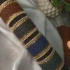 Add a touch of modern sophistication to your festive wardrobe with our Chic Collection. These sets feature a solid colors Matt Dot litter Bangles, accomapnied by thin Pearl Karay and Kut Pearl Karay. Whether you're dressing up for Eid celebrations or looking for the perfect bridesmaid gift, these sets offer a sleek, high-fashion alternative to traditional heavy jewelry