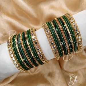 Exude effortless grace with Zoya, a set that lives up to its name by being a true delight to the eyes. This collection is the perfect marriage of Mirror Kundan artistry and the soft glow of golden nug Chori. Designed to be the ultimate versatile accessory, it features a timeless gold accent that complements any ensemble. Whether you are searching for the perfect Eid bangles or a bespoke bridesmaid gift, this set offers a royal touch that transcends trends.