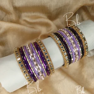 Exude effortless grace with Zoya, a set that lives up to its name by being a true delight to the eyes. This collection is the perfect marriage of Mirror Kundan artistry and the soft glow of golden nug Chori. Designed to be the ultimate versatile accessory, it features a timeless gold accent that complements any ensemble. Whether you are searching for the perfect Eid bangles or a bespoke bridesmaid gift, this set offers a royal touch that transcends trends.
